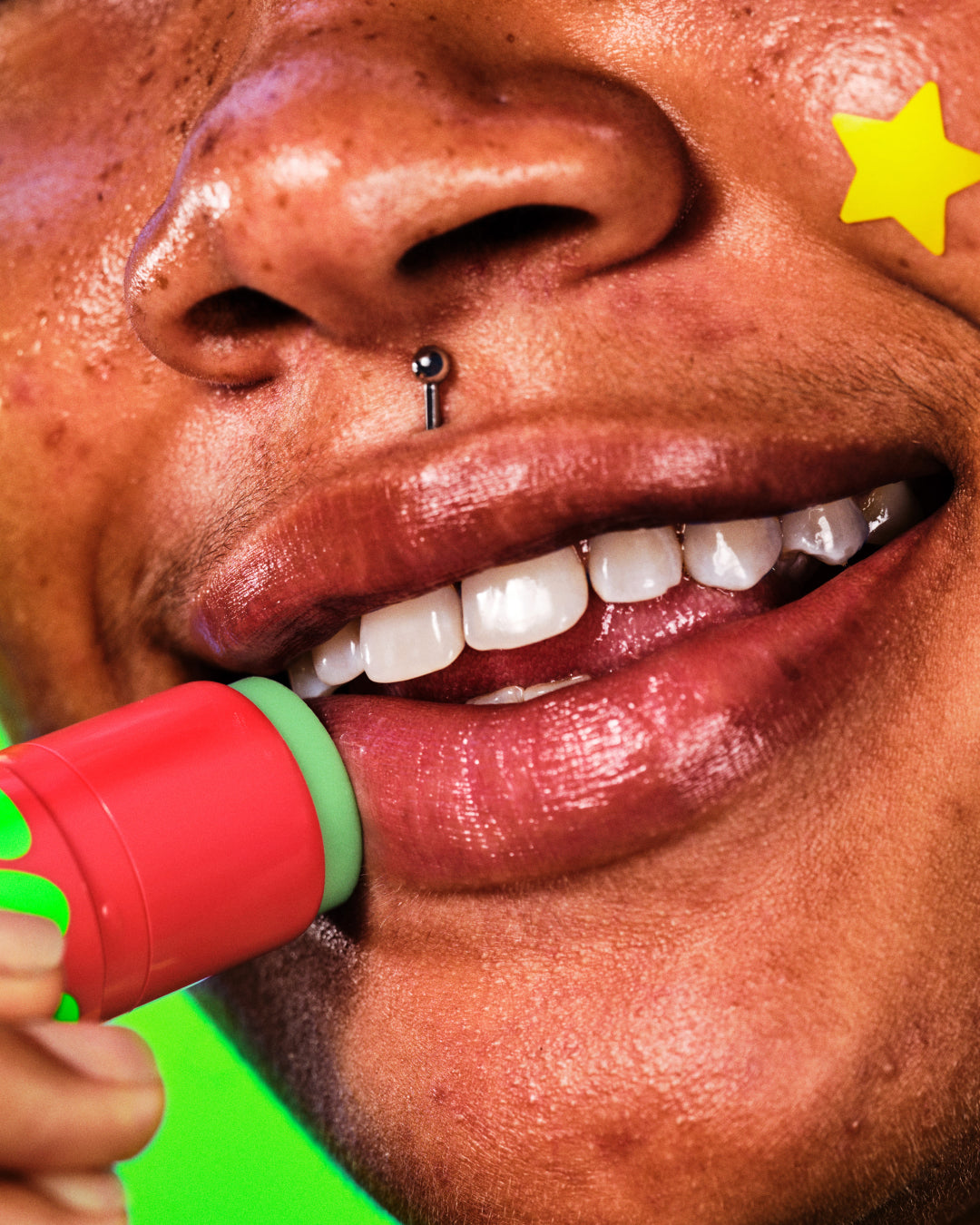 A model applies moisturizing Starface Star Balm Watermelon Squeeze on their lips. Tastes fresh, juicy, and sweet.