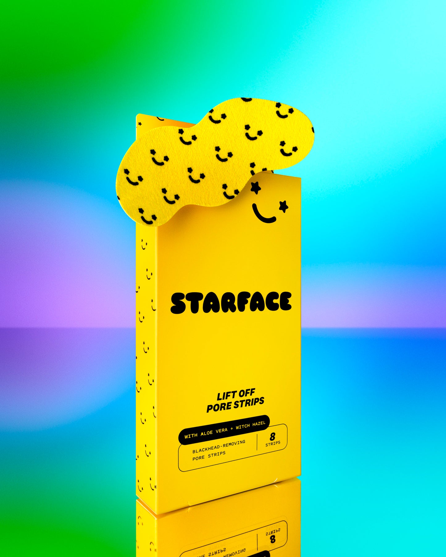 Starface Lift Off Pore Strips box on a purple, blue, and green background. One pore strip in yellow with black smiley faces unclogs pores and is in front of the box.
