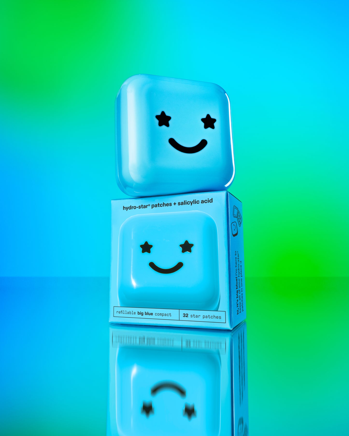 Two travel-friendly Hydro-Star® + Big Blue compact cases with black smiley faces stacked on top of each other.