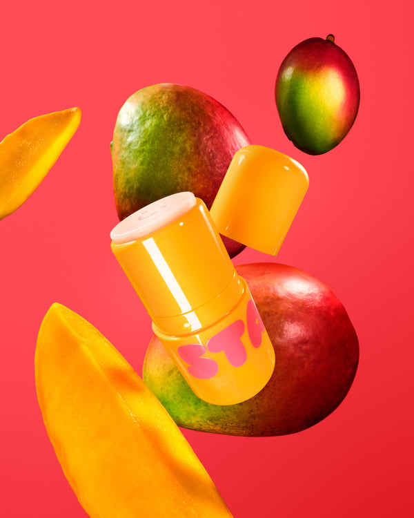 Starface Star Balm® Mango Mania lip balm uncapped. Shea butter, cocoa butter and coconut oil soothe dry lips.