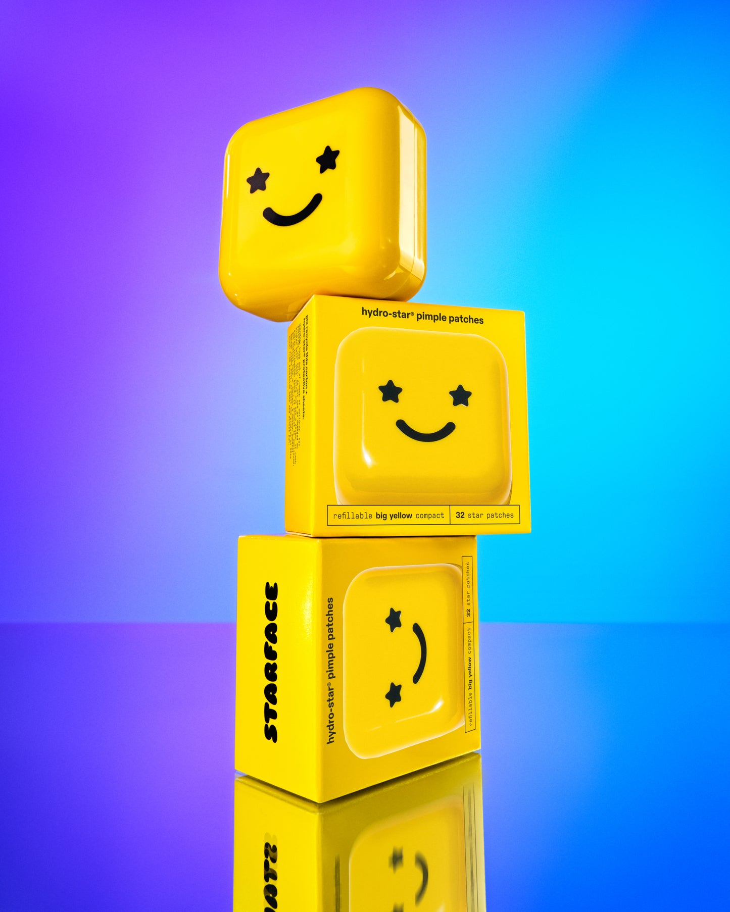 Three travel-friendly Hydro-Star® + Big Yellow compact cases with black smiley faces stacked on top of each other.