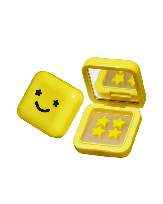 Big Yellow compact case with black smiley face has a mirror and Hydro-Star® hydrocolloid pimple patches inside.